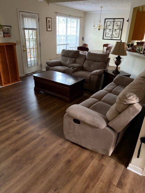 Family room after carpet replacement with finished Luxury Vinyl Plank flooring